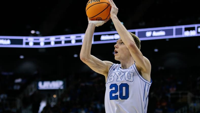Mar 13, 2024; Kansas City, MO, USA; Brigham Young Cougars guard Spencer Johnson (20) shoots the ball during the first half against the UCF Knights at T-Mobile Center. Mandatory Credit: William Purnell-USA TODAY Sports