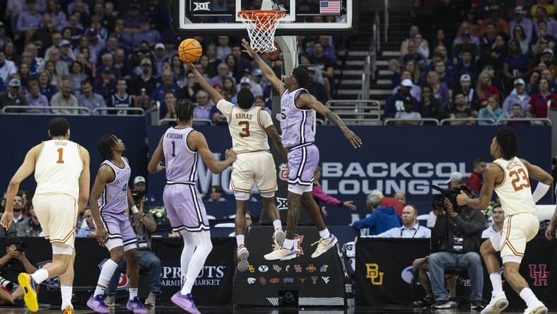 Mar 13, 2024; Kansas City, MO, USA; Texas Longhorns guard Max Abmas (3) shoots the ball while defended by Kansas State Wildcats guard Cam Carter (5) during the first half at T-Mobile Center. Mandatory Credit: Amy Kontras-USA TODAY Sports