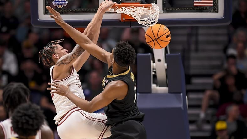 Mar 13, 2024; Nashville, TN, USA; Arkansas Razorbacks forward Trevon Brazile (2) slams the ball over Vanderbilt Commodores forward Ven-Allen Lubin (2) during the first half at Bridgestone Arena. Mandatory Credit: Steve Roberts-USA TODAY Sports
