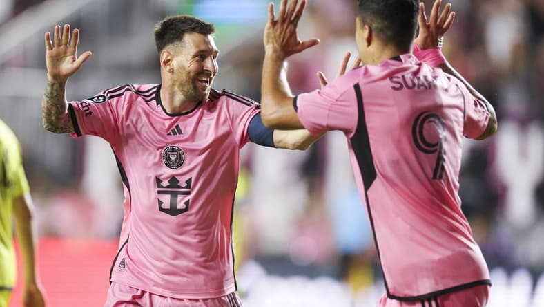 Mar 13, 2024; Fort Lauderdale, FL, USA; Inter Miami CF forward Lionel Messi (10) celebrates after scoring a goal with forward Luis Suarez (9) against the Nashville SC in the first half during the Concacaf round of sixteen at Chase Stadium. Mandatory Credit: Nathan Ray Seebeck-USA TODAY Sports