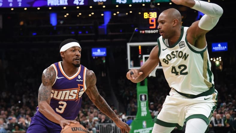 Mar 14, 2024; Boston, Massachusetts, USA; Phoenix Suns guard Bradley Beal (3) controls the ball while Boston Celtics center Al Horford (42) defends during the first half at TD Garden. Mandatory Credit: Bob DeChiara-USA TODAY Sports