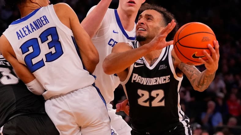 Mar 14, 2024; New York City, NY, USA; Providence Friars guard Devin Carter (22) drives on Creighton Bluejays guard Trey Alexander (23) and center Ryan Kalkbrenner (11) during the second half at Madison Square Garden. Mandatory Credit: Robert Deutsch-USA TODAY Sports