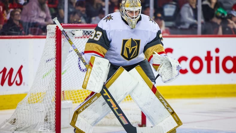 Mar 14, 2024; Calgary, Alberta, CAN; Vegas Golden Knights goaltender Adin Hill (33) guards his net against the Calgary Flames during the second period at Scotiabank Saddledome. Mandatory Credit: Sergei Belski-USA TODAY Sports