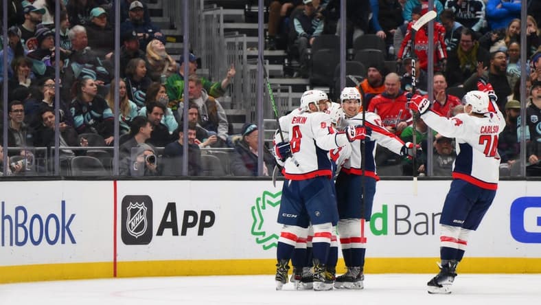 Mar 14, 2024; Seattle, Washington, USA; The Washington Capitals celebrate after a goal scored by right wing T.J. Oshie (77) against the Seattle Kraken during the second period at Climate Pledge Arena. Mandatory Credit: Steven Bisig-USA TODAY Sports