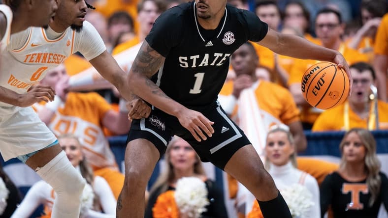 Mississippi State Bulldogs forward Tolu Smith (1) drives against Tennessee Volunteers forward Jonas Aidoo (0) during their SEC Men's Basketball Tournament quarterfinal game at Bridgestone Arena in Nashville, Tenn., Friday, March 15, 2024.