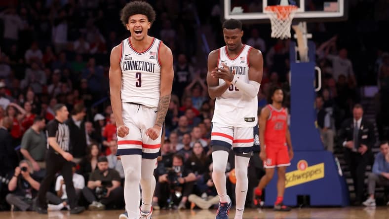 Mar 15, 2024; New York City, NY, USA; Connecticut Huskies forwards Jaylin Stewart (3) and Samson Johnson (35) react during the first half against the St. John's Red Storm at Madison Square Garden. Mandatory Credit: Brad Penner-USA TODAY Sports