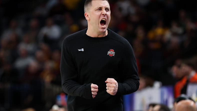 Mar 15, 2024; Minneapolis, MN, USA; Ohio State Buckeyes head coach Jake Diebler celebrates during the first half against the Illinois Fighting Illini at Target Center. Mandatory Credit: Matt Krohn-USA TODAY Sports