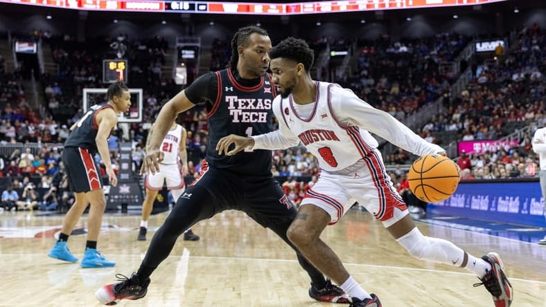 Mar 15, 2024; Kansas City, MO, USA; Houston Cougars guard Mylik Wilson (8) drives around Texas Tech Red Raiders guard Lamar Washington (1) during the first half at T-Mobile Center. Mandatory Credit: William Purnell-USA TODAY Sports