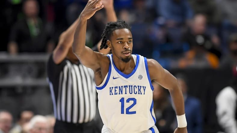 Mar 15, 2024; Nashville, TN, USA; Kentucky Wildcats guard Antonio Reeves (12) celebrates his three point basket against the Texas A&M Aggies during the first half at Bridgestone Arena. Mandatory Credit: Steve Roberts-USA TODAY Sports