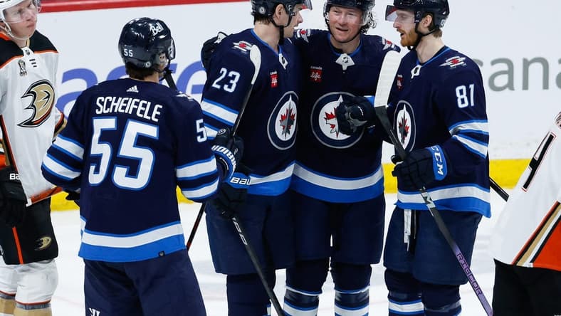 Mar 15, 2024; Winnipeg, Manitoba, CAN; Winnipeg Jets forward Tyler T0ffoli (73) is congratulated by his team mates on his goal against the Anaheim Ducks during the third period at Canada Life Centre. Mandatory Credit: Terrence Lee-USA TODAY Sports