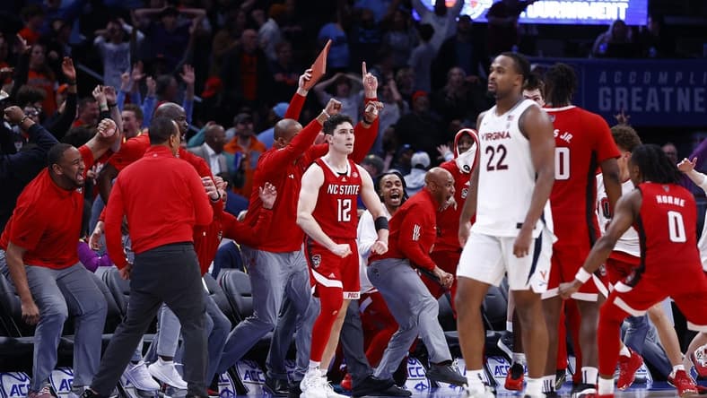 Mar 15, 2024; Washington, D.C., USA; North Carolina State Wolfpack guard Michael O'Connell (12) celebrates after shooting a three point shot at the buzzer during the second half against the Virginia Cavaliers at Capital One Arena. Mandatory Credit: Amber Searls-USA TODAY Sports