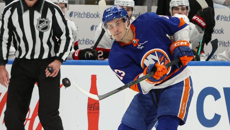 Mar 16, 2024; Elmont, New York, USA;  New York Islanders center Mathew Barzal (13) makes a pass against the Ottawa Senators during the second period at UBS Arena. Mandatory Credit: Thomas Salus-USA TODAY Sports