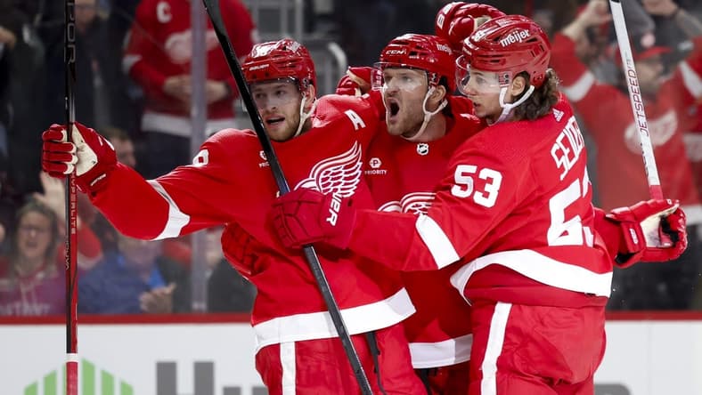 Mar 16, 2024; Detroit, Michigan, USA;  Detroit Red Wings right wing Christian Fischer (36) receives congratulations from center Andrew Copp (18) and defenseman Moritz Seider (53) after scoring in the second period against the Buffalo Sabres at Little Caesars Arena. Mandatory Credit: Rick Osentoski-USA TODAY Sports
