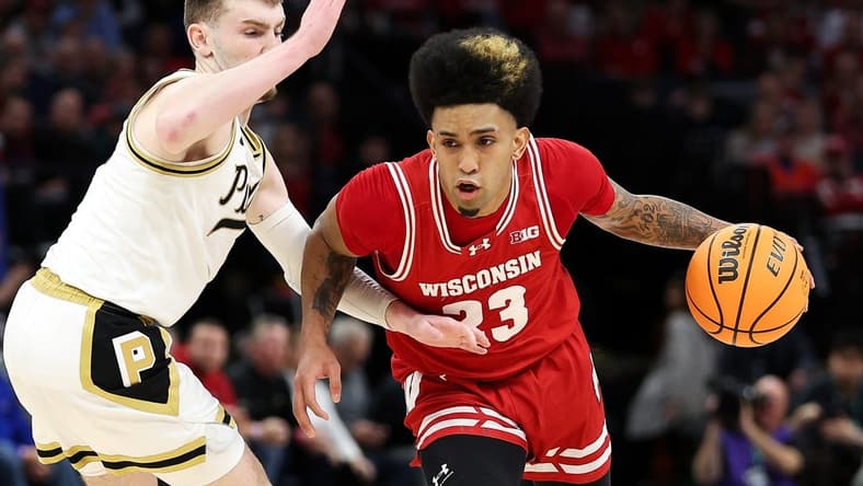 Mar 16, 2024; Minneapolis, MN, USA; Wisconsin Badgers guard Chucky Hepburn (23) works around Purdue Boilermakers guard Braden Smith (3) during the second half at Target Center. Mandatory Credit: Matt Krohn-USA TODAY Sports