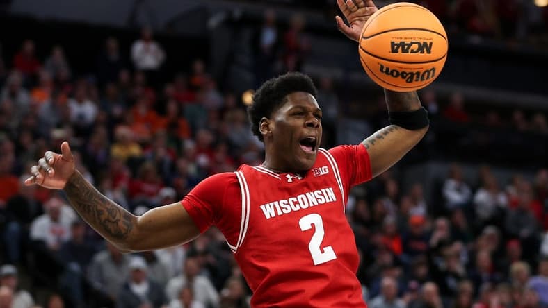 Mar 16, 2024; Minneapolis, MN, USA; Wisconsin Badgers guard AJ Storr (2) celebrates his dunk against the Purdue Boilermakers during the overtime at Target Center. Mandatory Credit: Matt Krohn-USA TODAY Sports