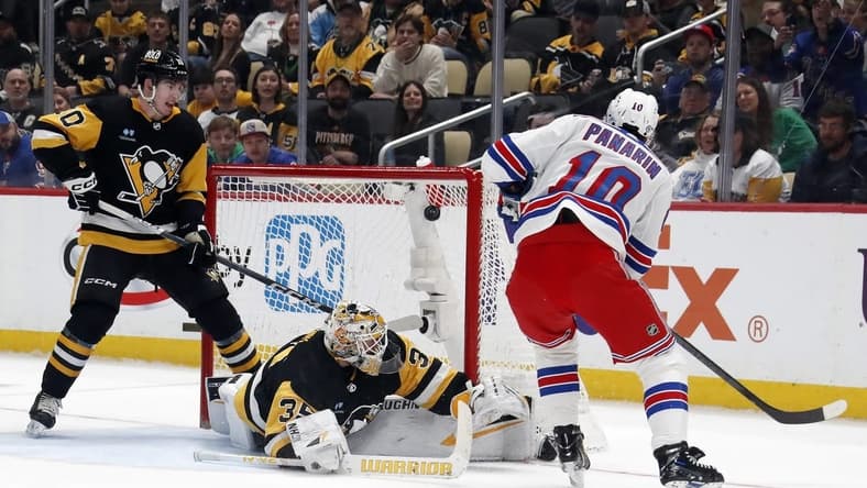 Mar 16, 2024; Pittsburgh, Pennsylvania, USA;  New York Rangers left wing Artemi Panarin (10) scores his second goal of the game against Pittsburgh Penguins goaltender Tristan Jarry (35) during the second period at PPG Paints Arena. Mandatory Credit: Charles LeClaire-USA TODAY Sports
