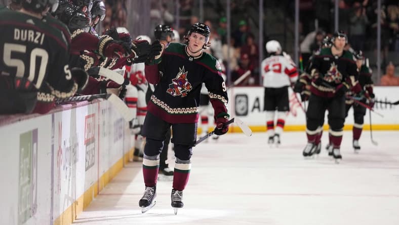 Mar 16, 2024; Tempe, Arizona, USA; Arizona Coyotes center Logan Cooley (92) celebrates his goal against the New Jersey Devils during the first period at Mullett Arena. Mandatory Credit: Joe Camporeale-USA TODAY Sports