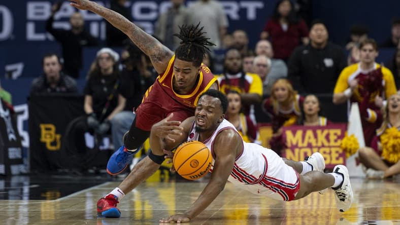 Mar 16, 2024; Kansas City, MO, USA; Iowa State Cyclones guard Keshon Gilbert (10) and Houston Cougars guard LJ Cryer (4) dive for a loose ball in the first half at T-Mobile Center. Mandatory Credit: Amy Kontras-USA TODAY Sports