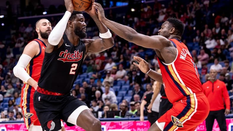 Mar 16, 2024; New Orleans, Louisiana, USA;  Portland Trail Blazers center Deandre Ayton (2) dribbles against New Orleans Pelicans forward Zion Williamson (1) during the first half at Smoothie King Center. Mandatory Credit: Stephen Lew-USA TODAY Sports