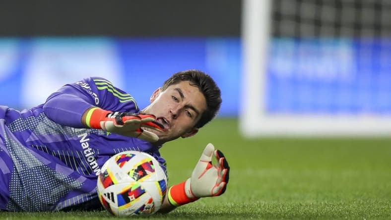 Mar 16, 2024; Columbus, Ohio, USA; Columbus Crew goalkeeper Patrick Schulte (28) makes a save against the New York Red Bulls in the first half at Lower.com Field. Mandatory Credit: Katie Stratman-USA TODAY Sports
