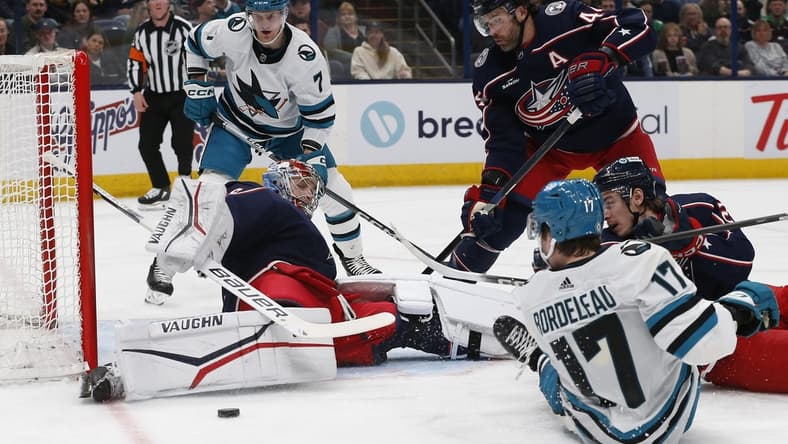 Mar 16, 2024; Columbus, Ohio, USA; Columbus Blue Jackets goalie Daniil Tarasov (40) makes a pad save on the shot from San Jose Sharks center Thomas Bordeleau (17) during the first period at Nationwide Arena. Mandatory Credit: Russell LaBounty-USA TODAY Sports