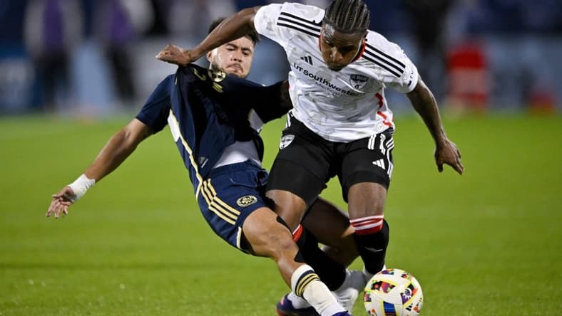 Mar 16, 2024; Frisco, Texas, USA; Vancouver Whitecaps defender Ryan Raposo (7) and FC Dallas forward Dante Sealy (11) battle for control of the ball during the first half at Toyota Stadium. Mandatory Credit: Jerome Miron-USA TODAY Sports