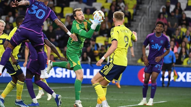 Mar 16, 2024; Nashville, Tennessee, USA; Nashville SC goalkeeper Joe Willis (1) catches the ball on a corner kick during the second half against Charlotte FC at Geodis Park. Mandatory Credit: Christopher Hanewinckel-USA TODAY Sports