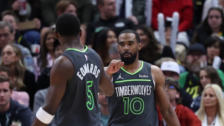 Mar 16, 2024; Salt Lake City, Utah, USA; Minnesota Timberwolves guard Mike Conley (10) reacts to a play against the Utah Jazz with guard Anthony Edwards (5) during the second quarter at Delta Center. Mandatory Credit: Rob Gray-USA TODAY Sports