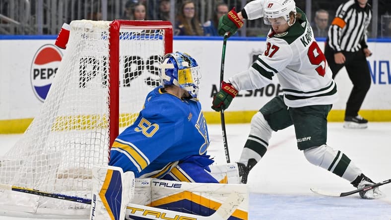 Mar 16, 2024; St. Louis, Missouri, USA; Minnesota Wild left wing Kirill Kaprizov (97) shoots and scores the game tying goal against St. Louis Blues goaltender Jordan Binnington (50) during the third period at Enterprise Center. Mandatory Credit: Jeff Curry-USA TODAY Sports