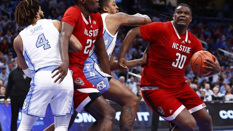 Mar 16, 2024; Washington, D.C., USA; North Carolina State Wolfpack forward DJ Burns Jr. (30) attempts to shoot the ball against the North Carolina Tar Heels during the second half at Capital One Arena. Mandatory Credit: Amber Searls-USA TODAY Sports