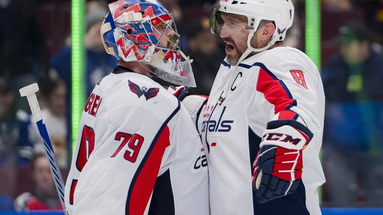 Mar 16, 2024; Vancouver, British Columbia, CAN; Washington Capitals goalie Charlie Lindgren (79) and forward Alex Ovechkin (8) celebrate their victory against the Vancouver Canucks at Rogers Arena. Washington won 2 -1. Mandatory Credit: Bob Frid-USA TODAY Sports