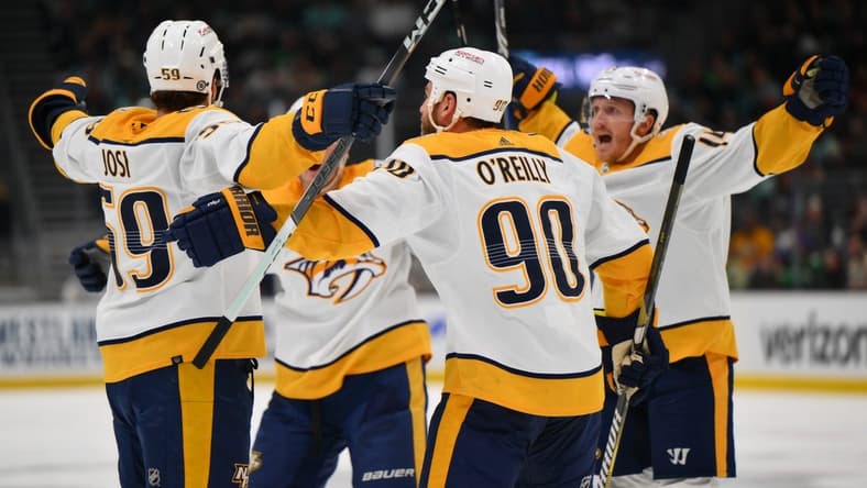 Mar 16, 2024; Seattle, Washington, USA; The Nashville Predators celebrate after defenseman Roman Josi (59) scored a goal against the Seattle Kraken during the third period at Climate Pledge Arena. Mandatory Credit: Steven Bisig-USA TODAY Sports