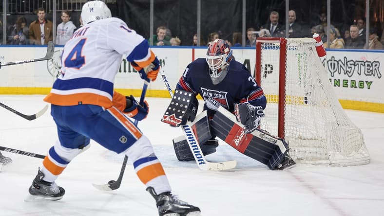 Mar 17, 2024; New York, New York, USA; New York Rangers goaltender Igor Shesterkin (31) defends the goal against New York Islanders center Bo Horvat (14) during the first period at Madison Square Garden. Mandatory Credit: Vincent Carchietta-USA TODAY Sports