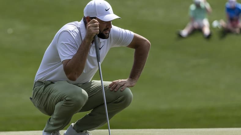 Mar 17, 2024; Ponte Vedra Beach, Florida, USA; Scottie Scheffler lines up a putt on the 3rd green during the final round of THE PLAYERS Championship golf tournament. Mandatory Credit: David Yeazell-USA TODAY Sports