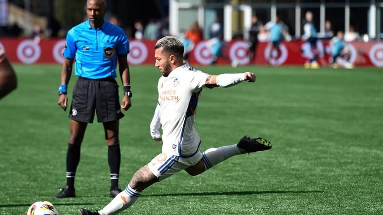 Mar 17, 2024; Foxborough, Massachusetts, USA; FC Cincinnati midfielder Luciano Acosta (10) scores a goal against the New England Revolution during the second half at Gillette Stadium. Mandatory Credit: Bob DeChiara-USA TODAY Sports