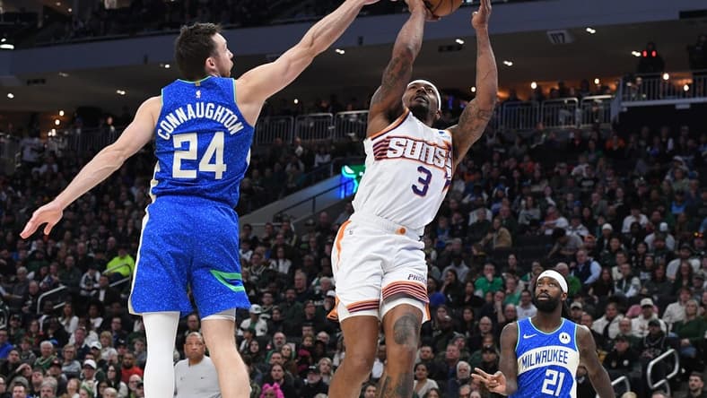 Mar 17, 2024; Milwaukee, Wisconsin, USA; Phoenix Suns guard Bradley Beal (3) drives to the basket against Milwaukee Bucks guard Pat Connaughton (24) in the second half at Fiserv Forum. Mandatory Credit: Michael McLoone-USA TODAY Sports