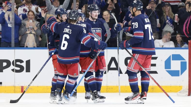 Mar 17, 2024; New York, New York, USA; New York Rangers left wing Alexis Lafreniere (13) celebrates his goal with teammates during the third period against the New York Islanders at Madison Square Garden. Mandatory Credit: Vincent Carchietta-USA TODAY Sports