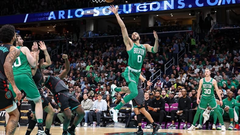 Mar 17, 2024; Washington, District of Columbia, USA; Boston Celtics forward Jayson Tatum (0) goes to the basket against the Washington Wizards during the first half of the game at Capital One Arena. Mandatory Credit: Scott Taetsch-USA TODAY Sports