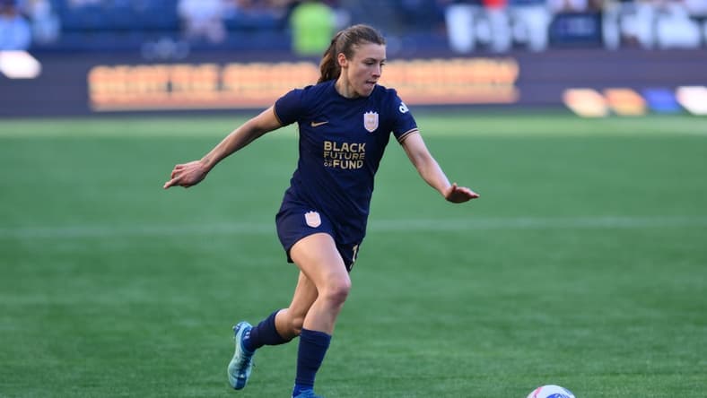 Mar 17, 2024; Seattle, Washington, USA; Seattle Reign defender Sofia Huerta (11) moves the ball against the Washington Spirit during the second half at Lumen Field. Mandatory Credit: Steven Bisig-USA TODAY Sports