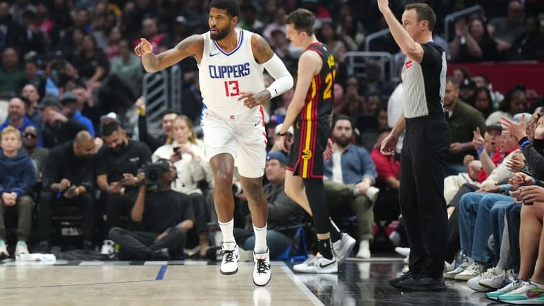 Mar 17, 2024; Los Angeles, California, USA; LA Clippers forward Paul George (13) gestures after a three-point basket against the Atlanta Hawks in the second half at Crypto.com Arena. Mandatory Credit: Kirby Lee-USA TODAY Sports