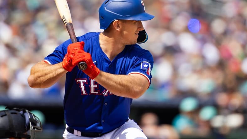 Mar 18, 2024; Surprise, Arizona, USA; Texas Rangers outfielder Wyatt Langford against the Seattle Mariners during a spring training baseball game at Surprise Stadium. Mandatory Credit: Mark J. Rebilas-USA TODAY Sports