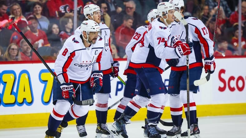 Mar 18, 2024; Calgary, Alberta, CAN; Washington Capitals left wing Alex Ovechkin (8) celebrates his goal with teammates against the Calgary Flames during the second period at Scotiabank Saddledome. Mandatory Credit: Sergei Belski-USA TODAY Sports