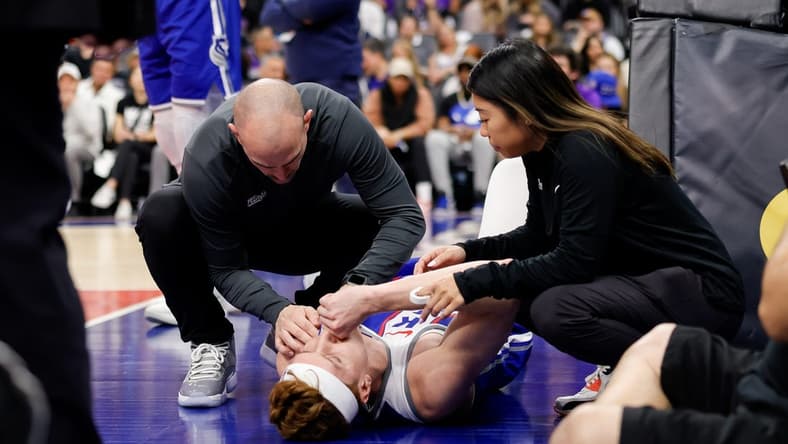 Mar 18, 2024; Sacramento, California, USA; Sacramento Kings guard Kevin Huerter (9) suffers an injury during the first quarter against the Memphis Grizzlies at Golden 1 Center. Mandatory Credit: Sergio Estrada-USA TODAY Sports