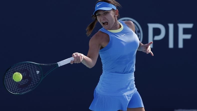 Mar 19, 2024; Miami Gardens, FL, USA; Simona Halep (ROU) hits a forehand against Paula Badosa (ESP) (not pictured) on day two of the Miami Open at Hard Rock Stadium. Mandatory Credit: Geoff Burke-USA TODAY Sports