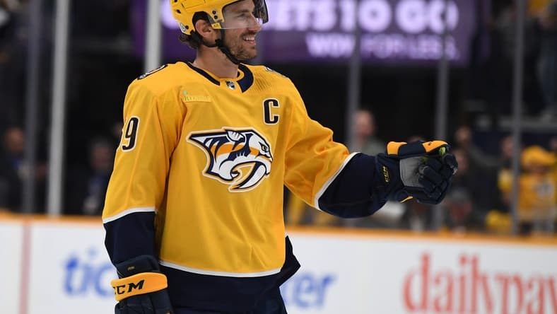 Mar 19, 2024; Nashville, Tennessee, USA; Nashville Predators defenseman Roman Josi (59) celebrates after scoring during the first period against the San Jose Sharks at Bridgestone Arena. Mandatory Credit: Christopher Hanewinckel-USA TODAY Sports