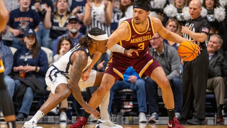 Butler Bulldogs guard Posh Alexander, left, defends Minnesota Golden Gophers forward Dawson Garcia (3) during the first half of an NCAA/NIT game, Tuesday, March 19, 2024, at Hinkle Fieldhouse on the campus of Butler University in Indianapolis.
