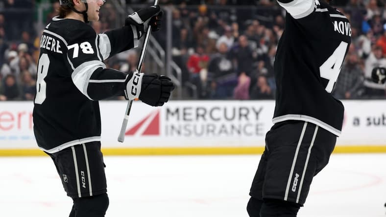 Mar 19, 2024; Los Angeles, California, USA;  Los Angeles Kings right wing Alex Laferriere (78) celebrates with defenseman Jacob Moverare (43) after scoring a goal against Chicago Blackhawks during the first period at Crypto.com Arena. Mandatory Credit: Kiyoshi Mio-USA TODAY Sports