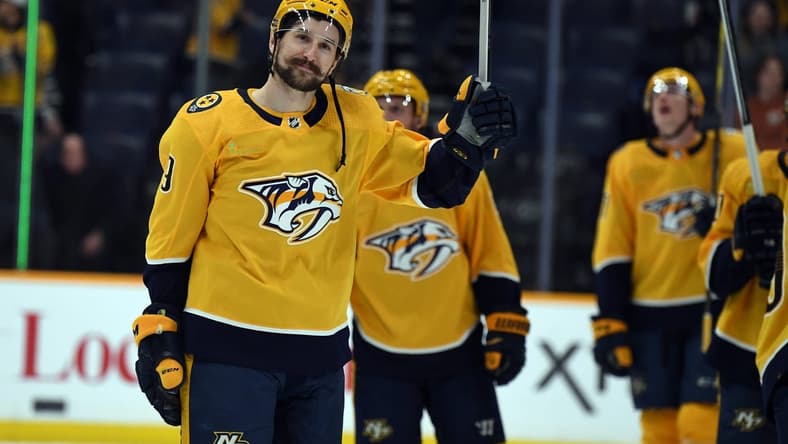 Mar 19, 2024; Nashville, Tennessee, USA; Nashville Predators left wing Filip Forsberg (9) waives to the fans after a win against the San Jose Sharks at Bridgestone Arena. Mandatory Credit: Christopher Hanewinckel-USA TODAY Sports