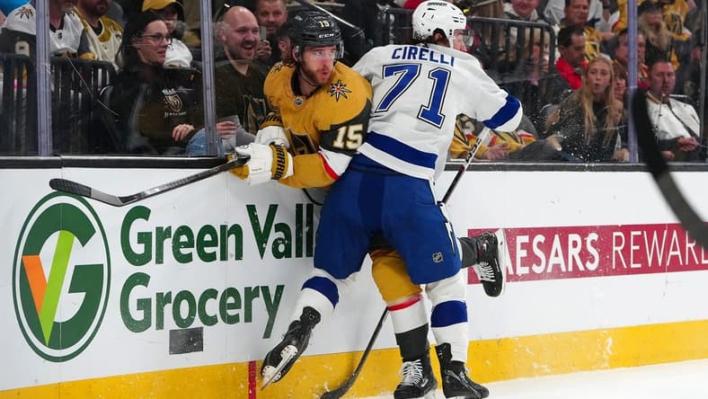 Mar 19, 2024; Las Vegas, Nevada, USA; Tampa Bay Lightning center Anthony Cirelli (71) checks Vegas Golden Knights defenseman Noah Hanifin (15) during the first period at T-Mobile Arena. Mandatory Credit: Stephen R. Sylvanie-USA TODAY Sports