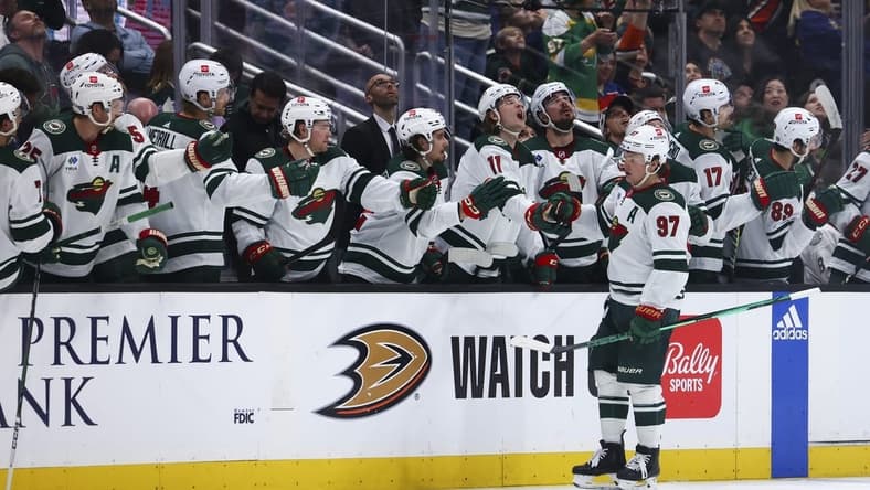 Mar 19, 2024; Anaheim, California, USA; Minnesota Wild left wing Kirill Kaprizov (97) celebrates with his teammates after scoring a goal against the Anaheim Ducks during the second period of a game at Honda Center. Mandatory Credit: Jessica Alcheh-USA TODAY Sports